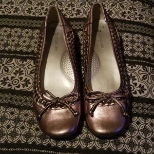 Bronze comfort flats with a slight wedge heel